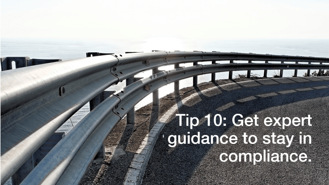 (Tip 10: Get expert guidance to stay in compliance.) Road curve that has guard rails in place.